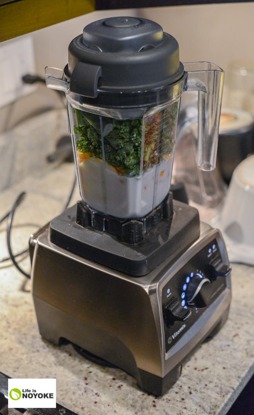 Apple carrot kale smoothie ingredients in a Vitamix Pro 750 and 32 ounce container.