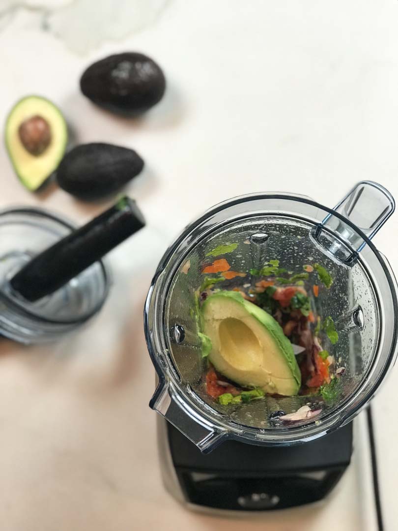 Avocado over guacamole ingredients in our Vitamix A3500.