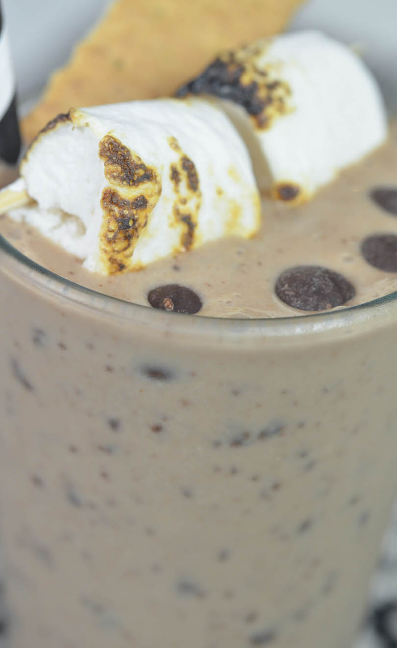 Frosty smores smoothie served with roasted marshmellos and chocolate chips.