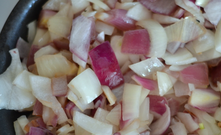 Close up of sauteed red onions for five alarm chili
