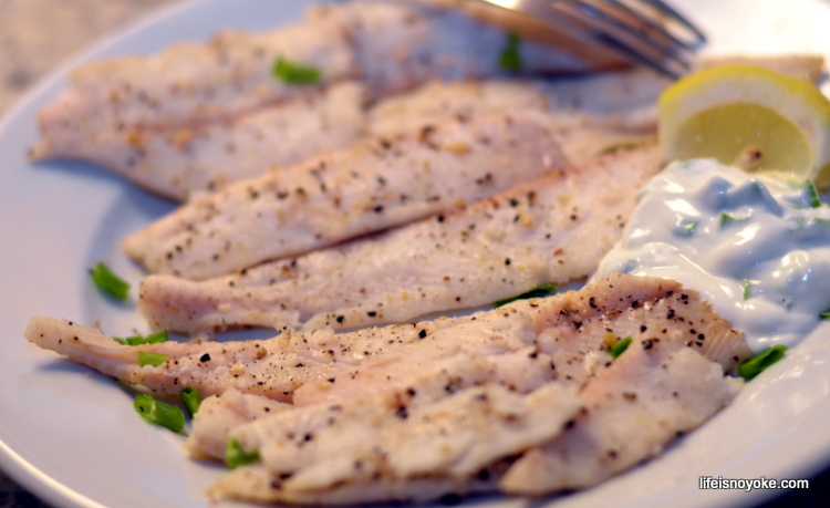 Baked Dover Sole served with greek yogurt fish sauce and lemon wedge