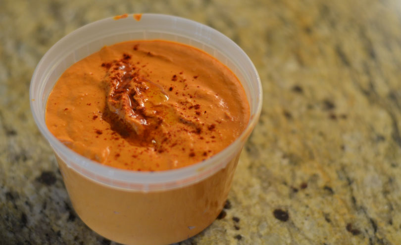 Roasted red pepper hummus served