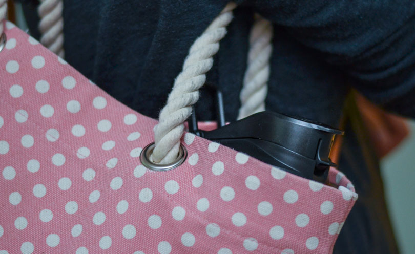 S30 portable container in pink polka dot shoulder bag.