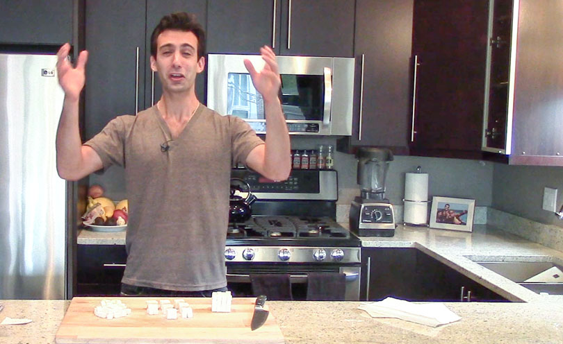 Lenny Gale in kitchen using sugar cubes to explain why food particle size matters for better tasting food. 