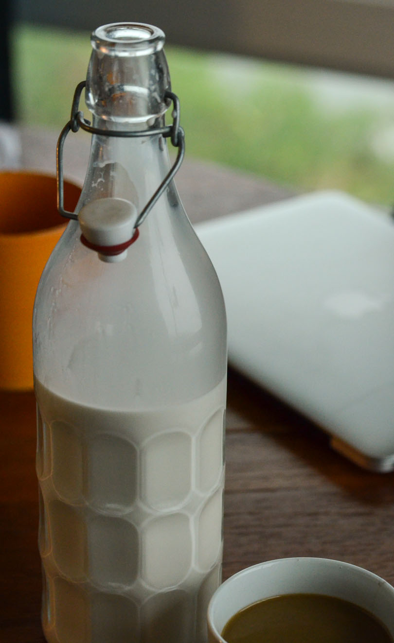 Homemade almond milk in a tall jug.