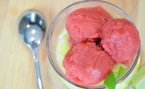 Three scoops of berry lime sorbet served in small glass dish.