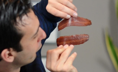 Lenny Gale playing with bacon for a video on getting cancer from red and cured meats.