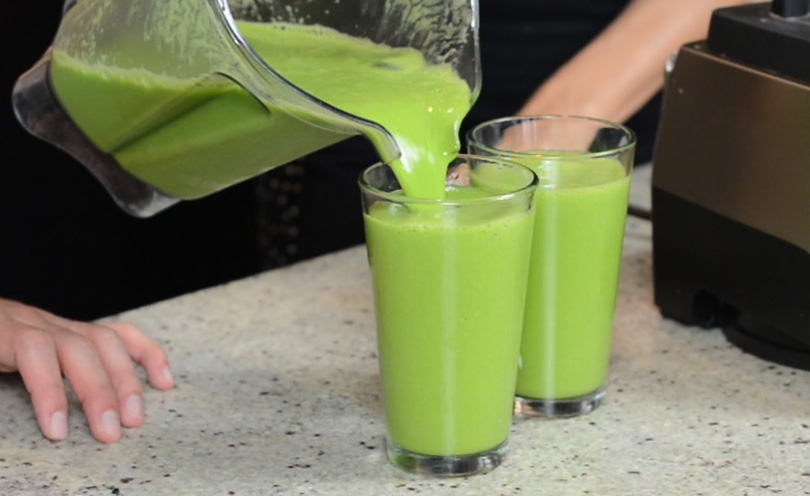 I am spicy hot green juice being poured into tall glass.