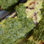 Chimichurri sauce served on grilled zucchini.