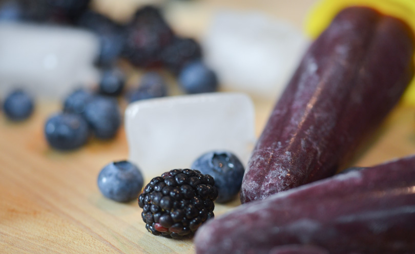 Two blueberry blackberry popsicles served.