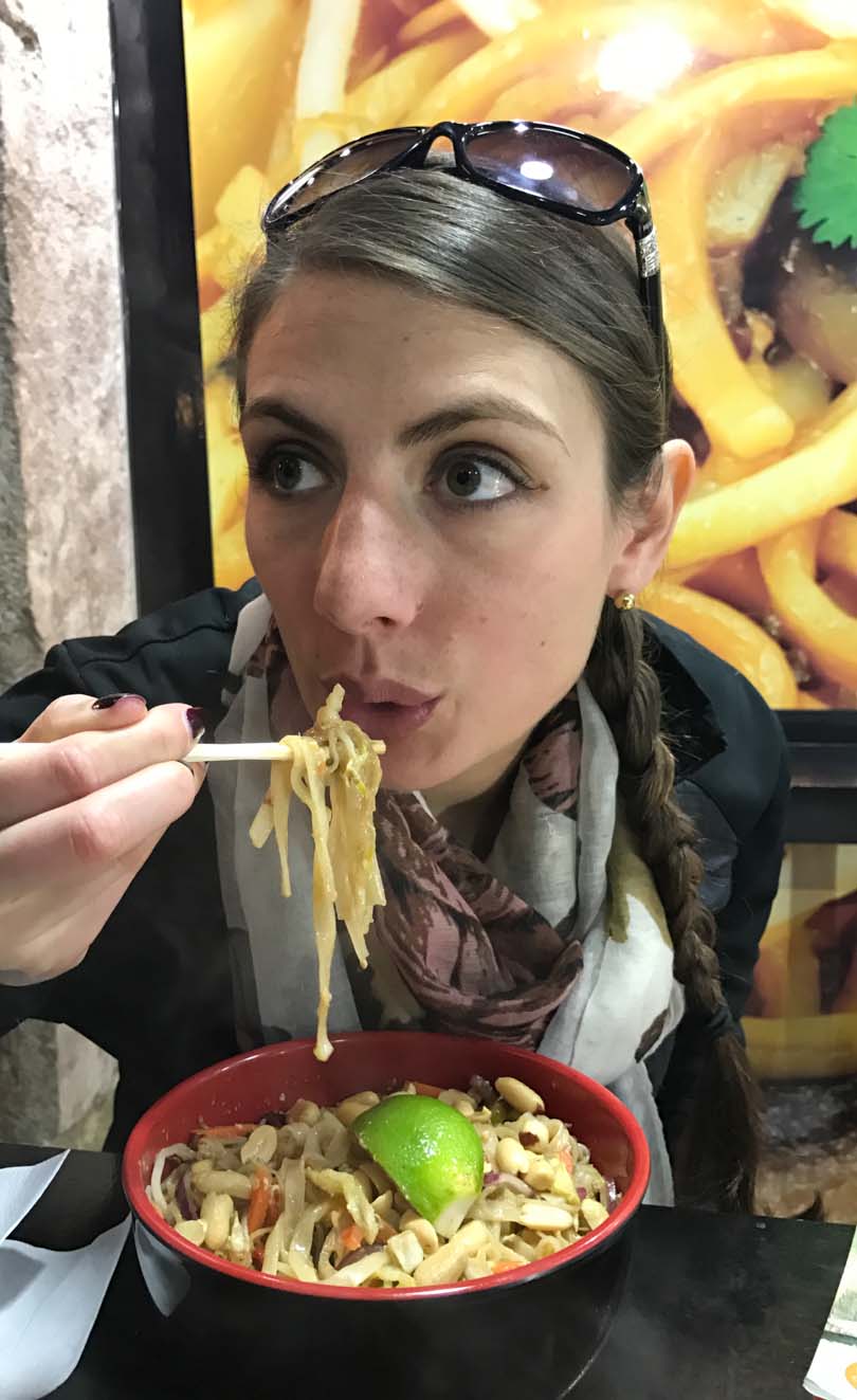 Shalva eating noodles in Spain.