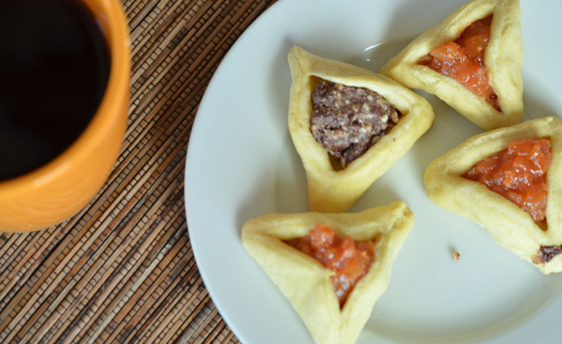Vegan hamentashen with a cup of coffee