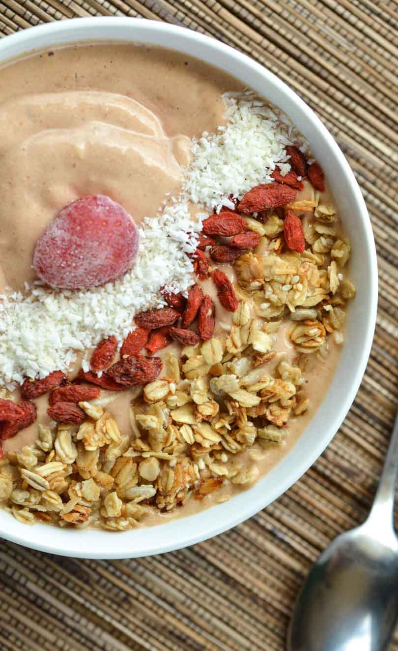 Sa-Saquash smoothie bowl with a frozen strawberry in the middle.