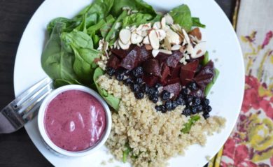 Blueberry vinaigrette served with a spinach and beet and quinoa salad.