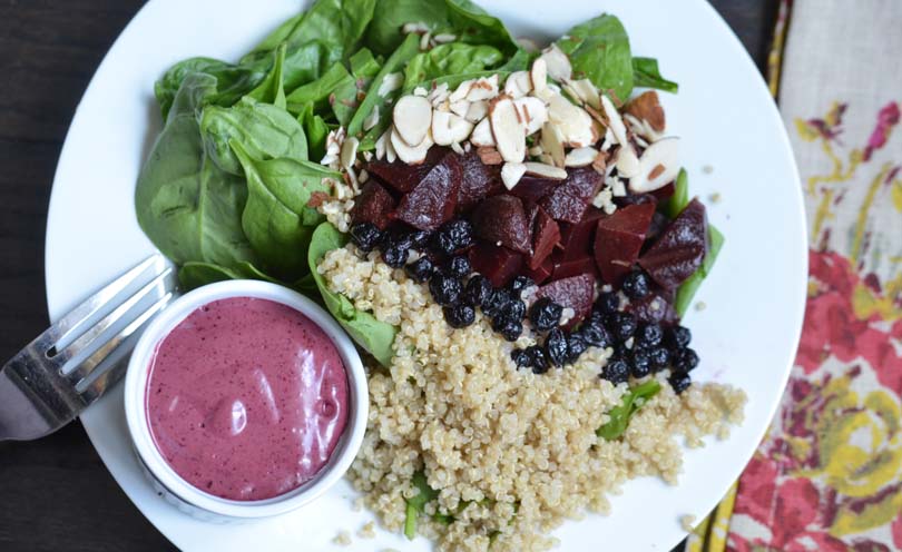 Blueberry vinaigrette served with a spinach and beet and quinoa salad.