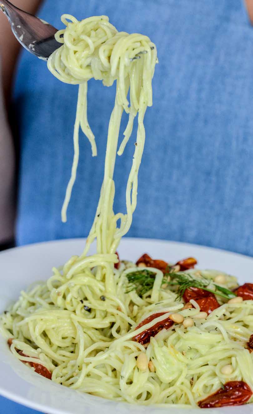 A forkful of avo dill sauce-drenched pasta.