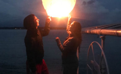 Lenny and Shalva with a wish lantern at the lake in 2017.