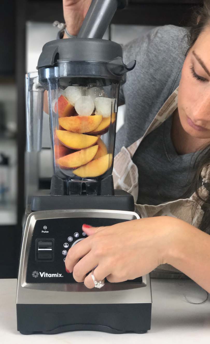 Shalva using a 32 oz container on a Vitamix Pro 750 to make peach buzz sorbet.