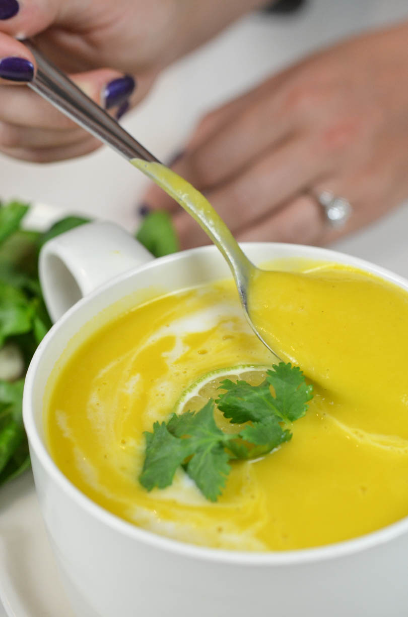 A spoonful of thai pumpkin soup made in our Vitamix.