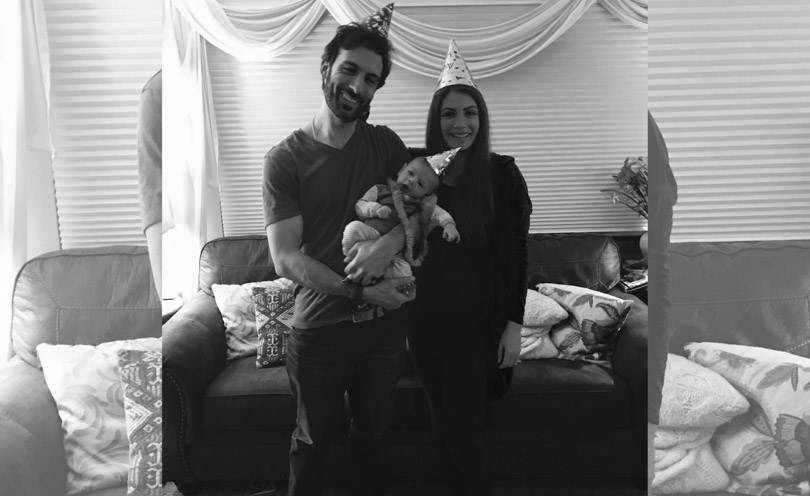 Black and white photo of Lenny and Shalva Gale with baby on New Years 2018.