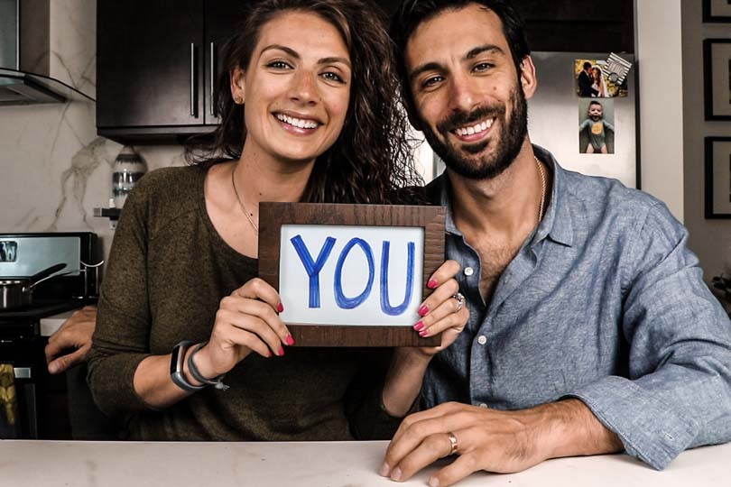 Shalva and Lenny Gale with "you" sign