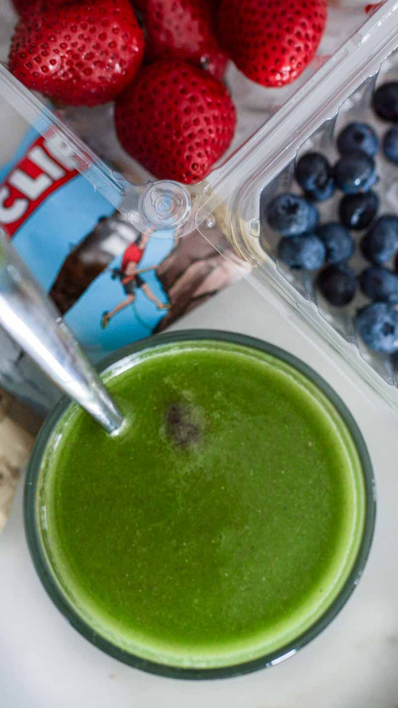 green juice with side of berries and a Clif bar.